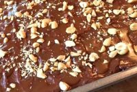 Chocolate Caramel Poke Cake That Tastes Like a Snickers Bar