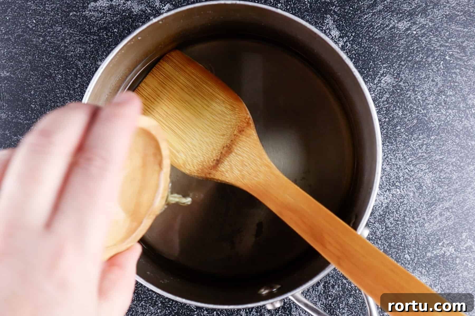 adding mint extract to saucepan