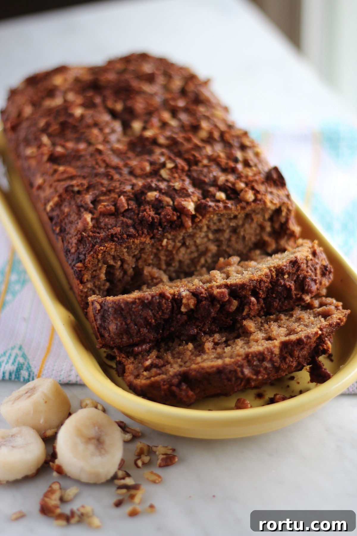 Grain-Free Streusel Banana Bread- a paleo, gluten-free banana bread loaded with pecan cinnamon streusel on top! Delicious for breakfast or dessert! | fedandfulfilled.com