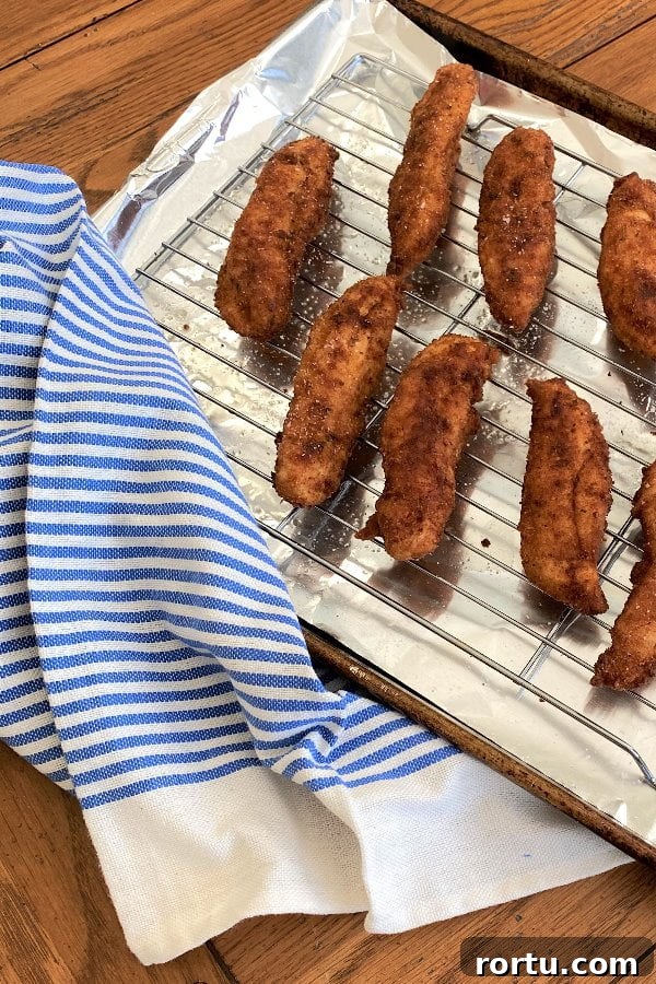Crispy Buttermilk Fried Chicken Tenders Recipe 6 baking rack with chicken tenders.