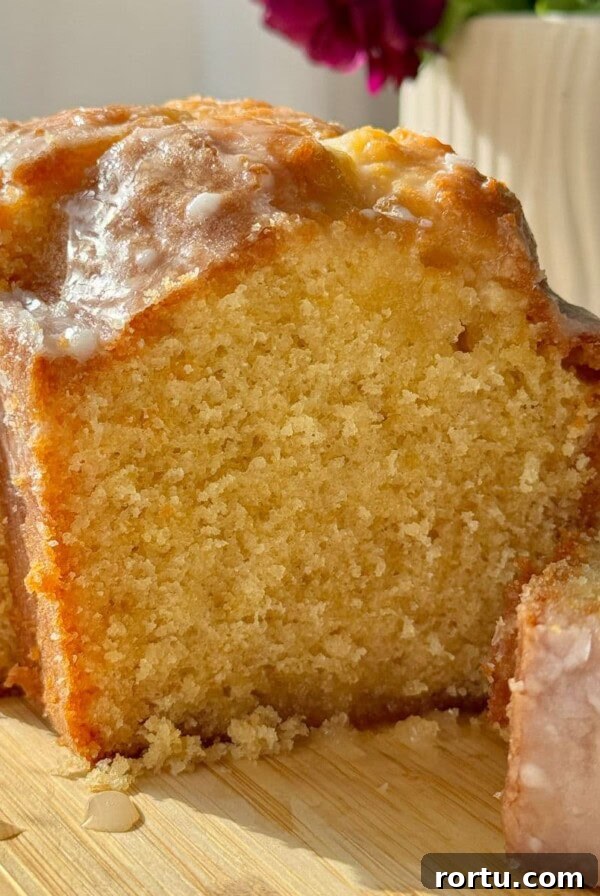 Ballymaloe Tunisian Orange Cake Recipe — Gluten-Free Version 11 lemon loaf cake on wooden board.