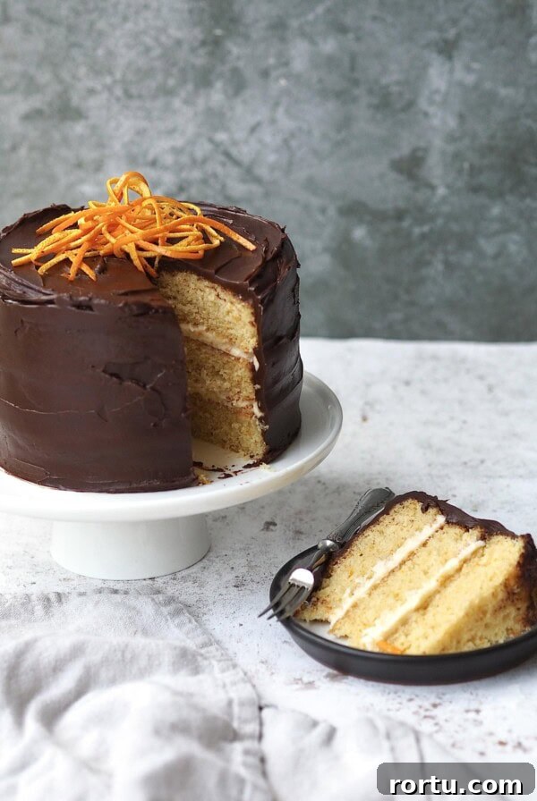 Ballymaloe Tunisian Orange Cake Recipe — Gluten-Free Version 14 jaffa cake cake with a slice removed on a black plate
