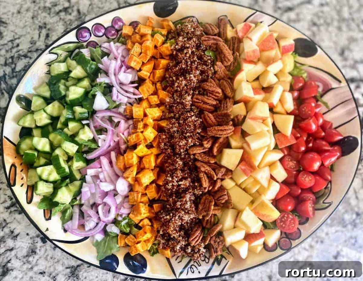 A platter of salad on the counter. 