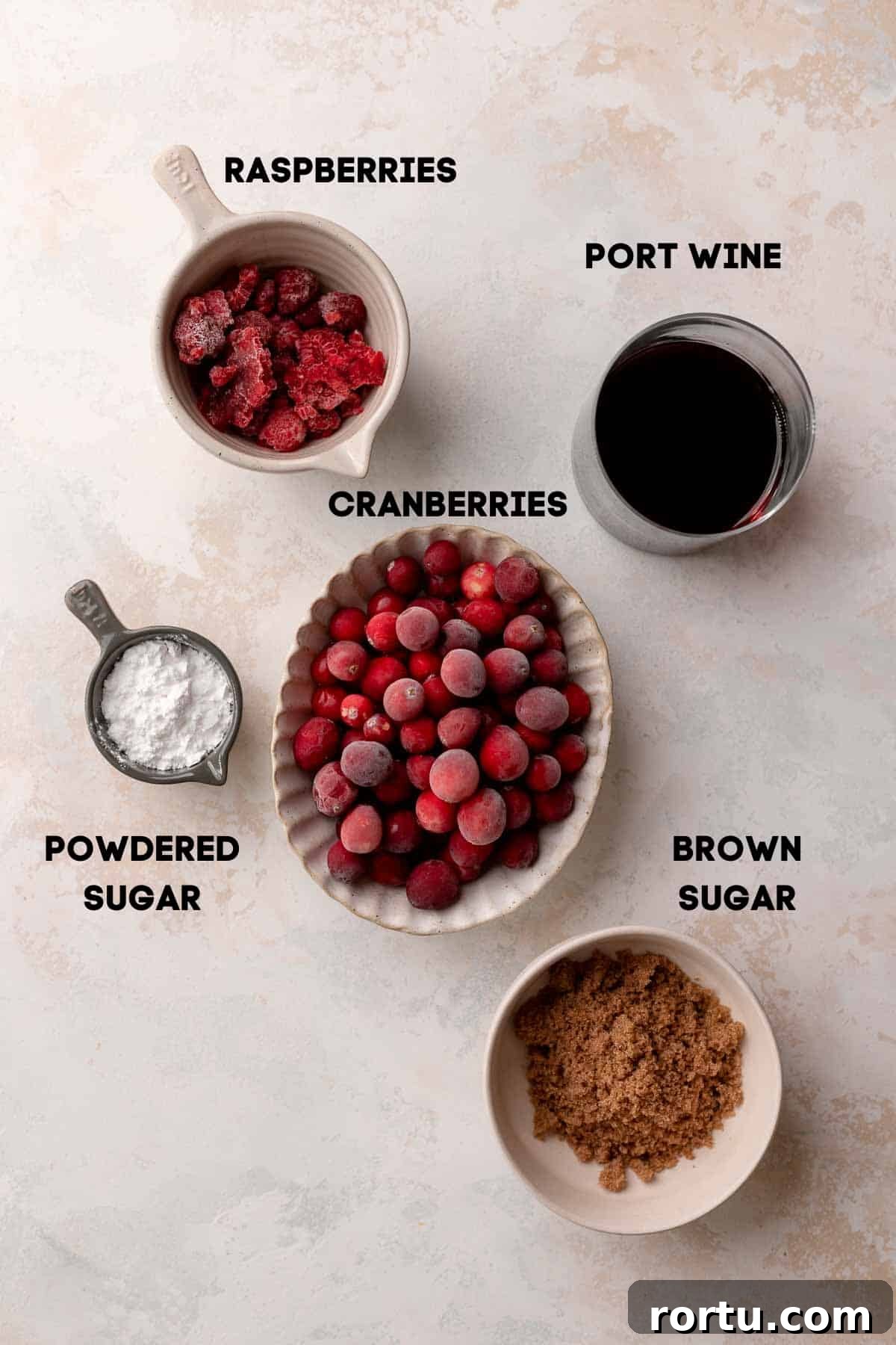 Raspberry Jam Linzer Shortbread Cookies: Classic Sandwich Recipe 5 ingredients needed to make the cranberry raspberry jam in bowls with labels.