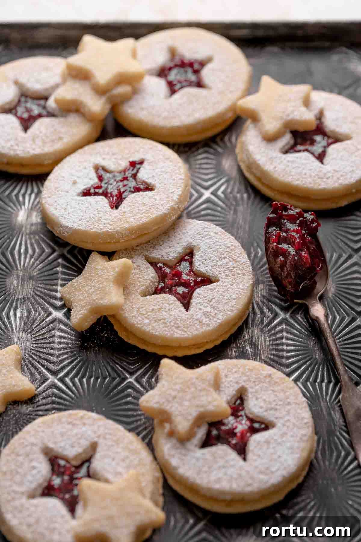 Raspberry Jam Linzer Shortbread Cookies: Classic Sandwich Recipe 9 shortbread linzer cookies filled with raspberry jam and dusted with powdered sugar.