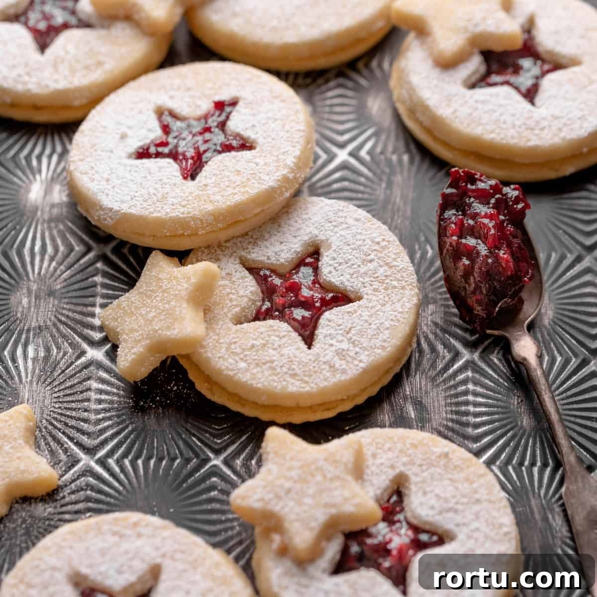 Raspberry Jam Linzer Shortbread Cookies: Classic Sandwich Recipe 10 shortbread linzer cookies filled with raspberry jam and dusted with powdered sugar.