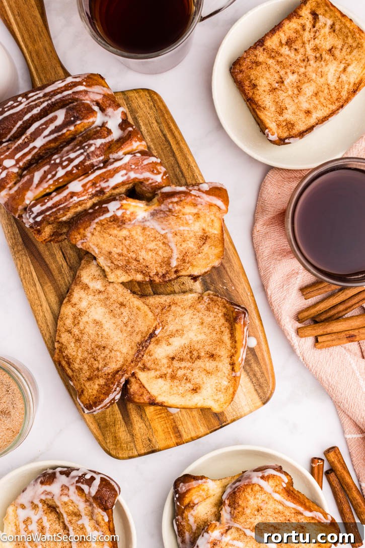 cinnamon pull apart bread with sweet powdered sugar glaze dripping