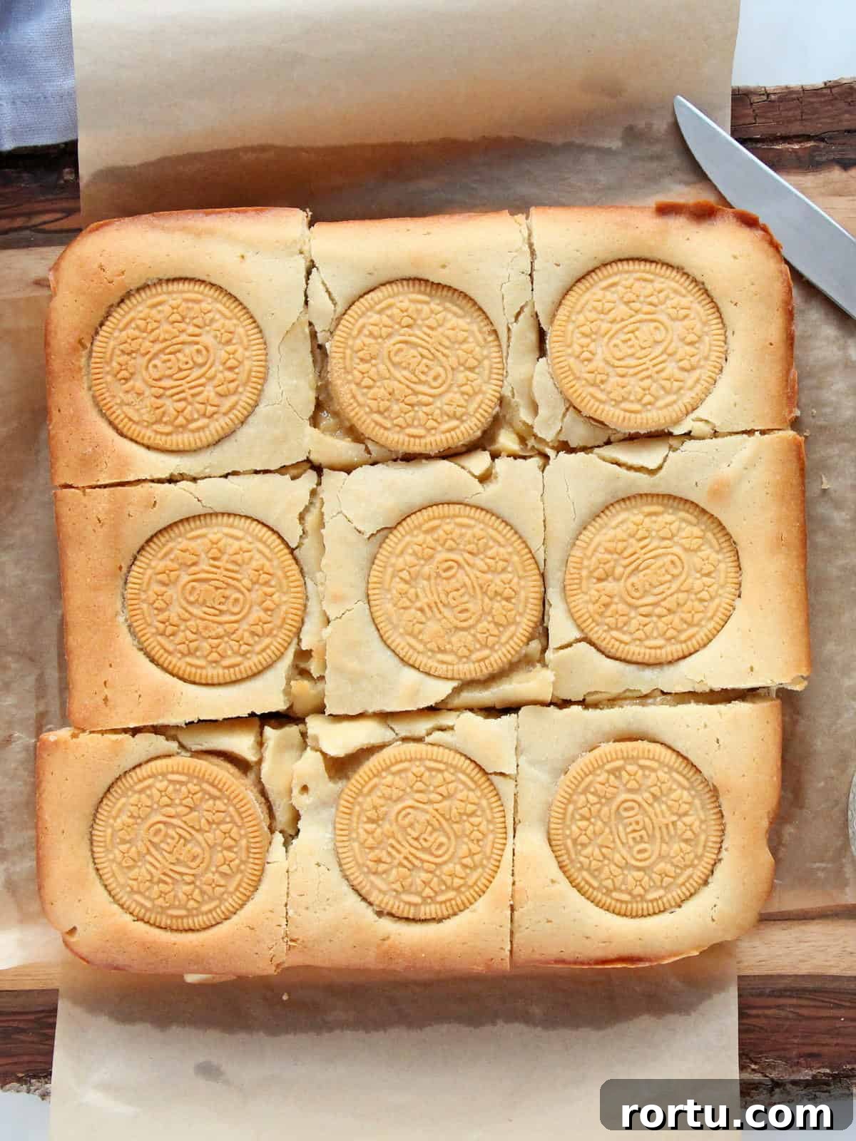 Oreo Blondies cut in squares on parchment paper