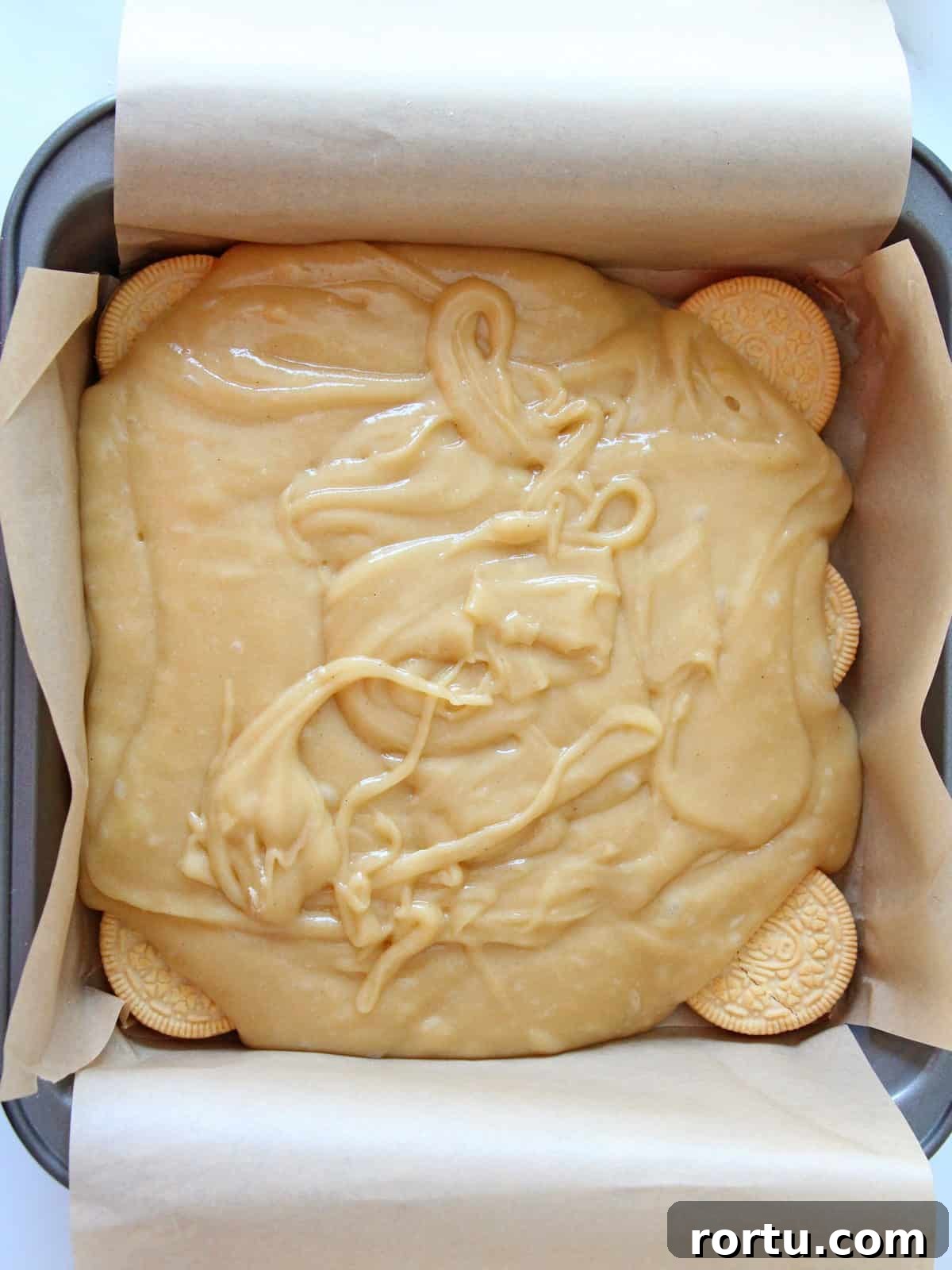 Fresh batter for blondies spread inside pan 