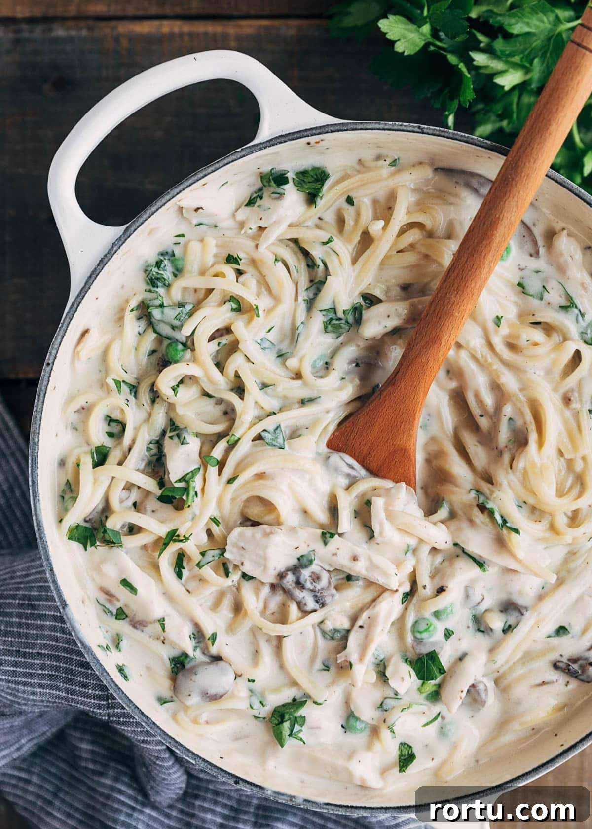 unbaked turkey tetrazzini with linguine noodles in a pot