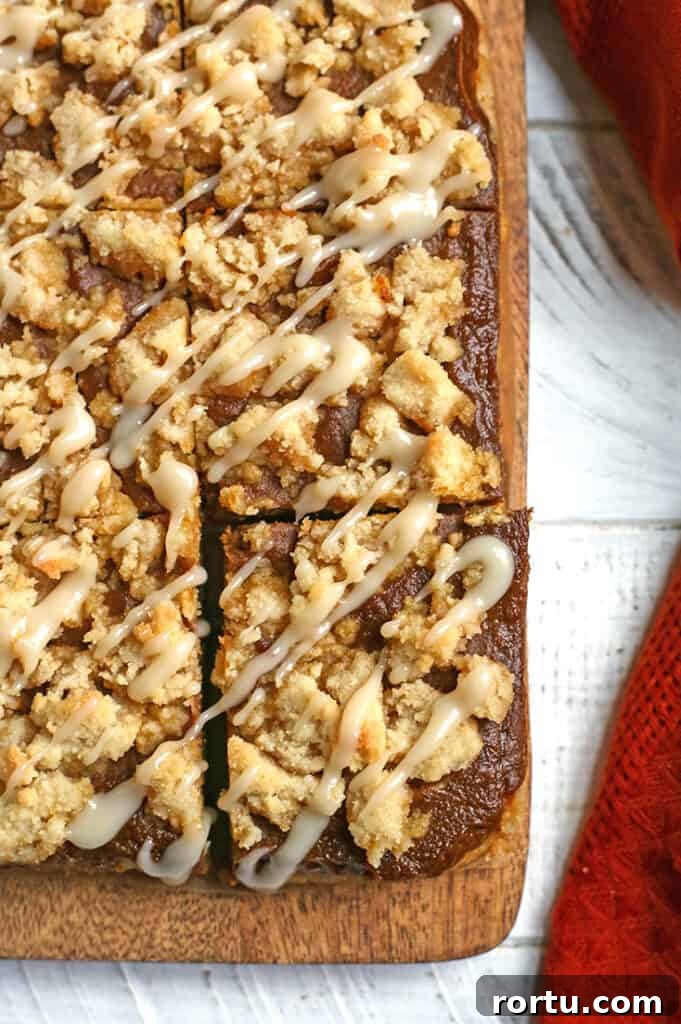 Paleo Vegan Pumpkin Crumble Bars for Fall Baking 3 cutting board with paleo pumpkin pie crumb bars on it