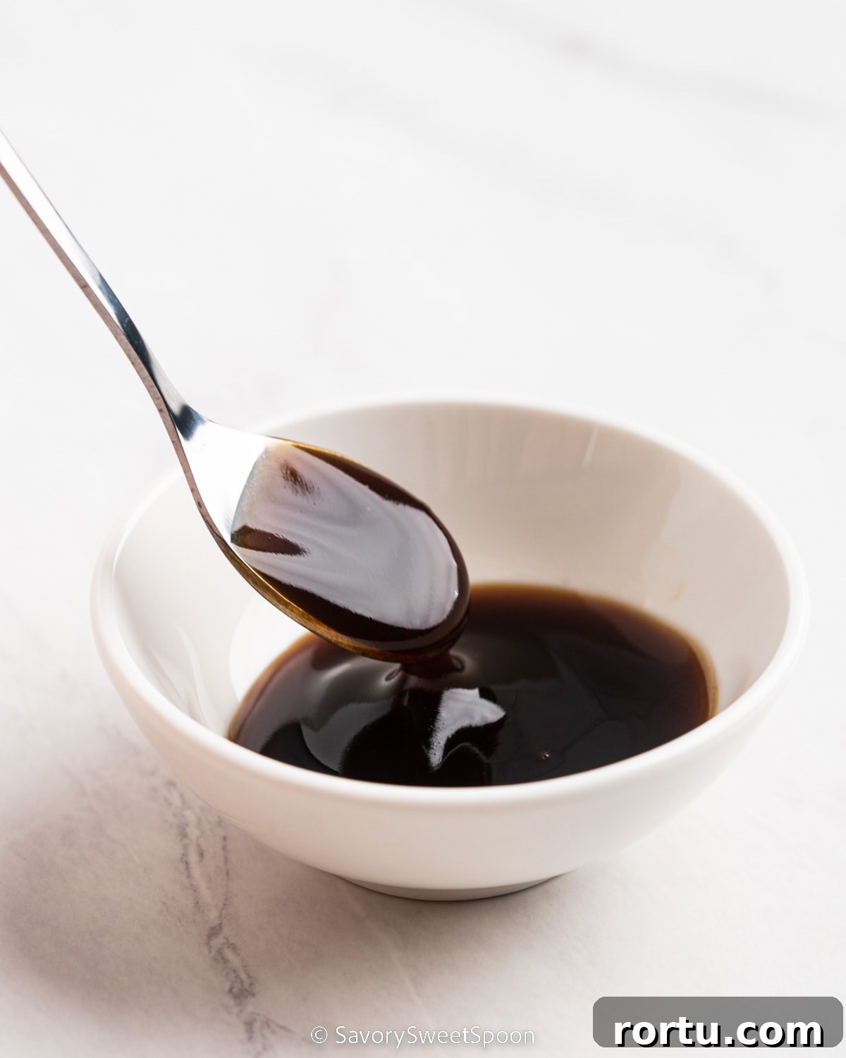 bowl and spoonful of oyster sauce.