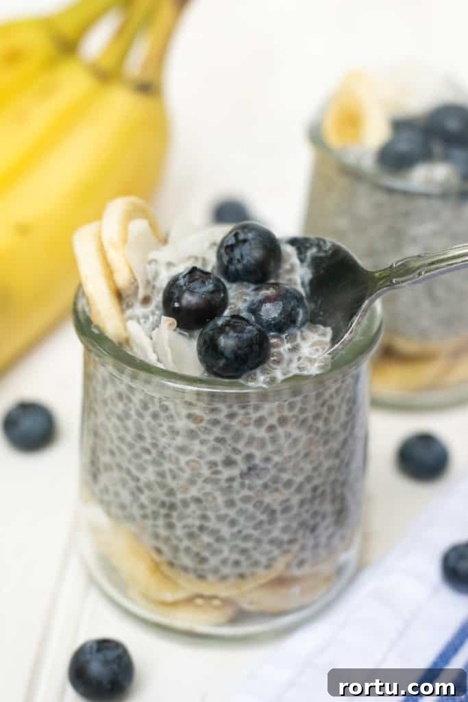 This basic chia seed pudding takes 60 seconds to prep and is the perfect base for all of your favorite toppings! Spoonful of chia pudding in a jar