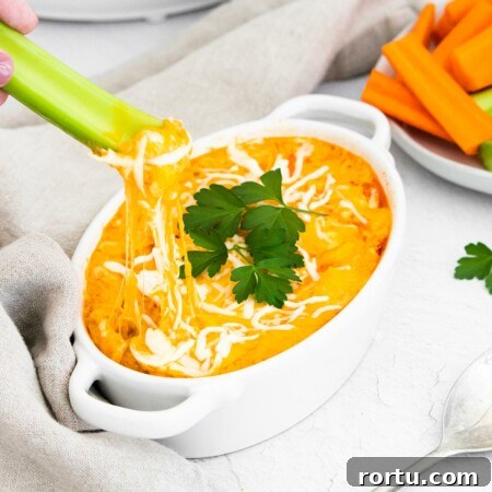 Instant Pot Buffalo Chicken Dip Recipe — Creamy, Spicy Party Dip 8 Instant Pot Buffalo Chicken Dip with a celery stick