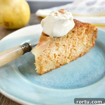 Olive Oil Pear Cake with Ginger and Cinnamon 10 close up cake slice with whipped cream fork on plate