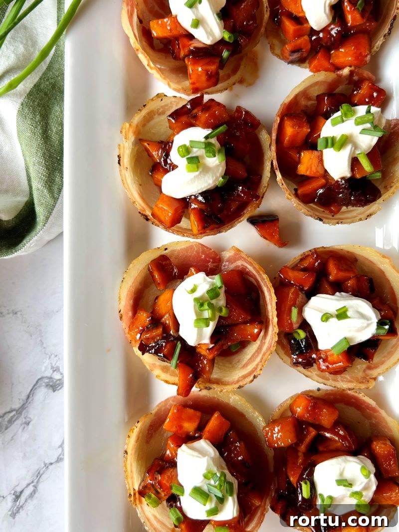Assembled bacon cups on a white platter. 