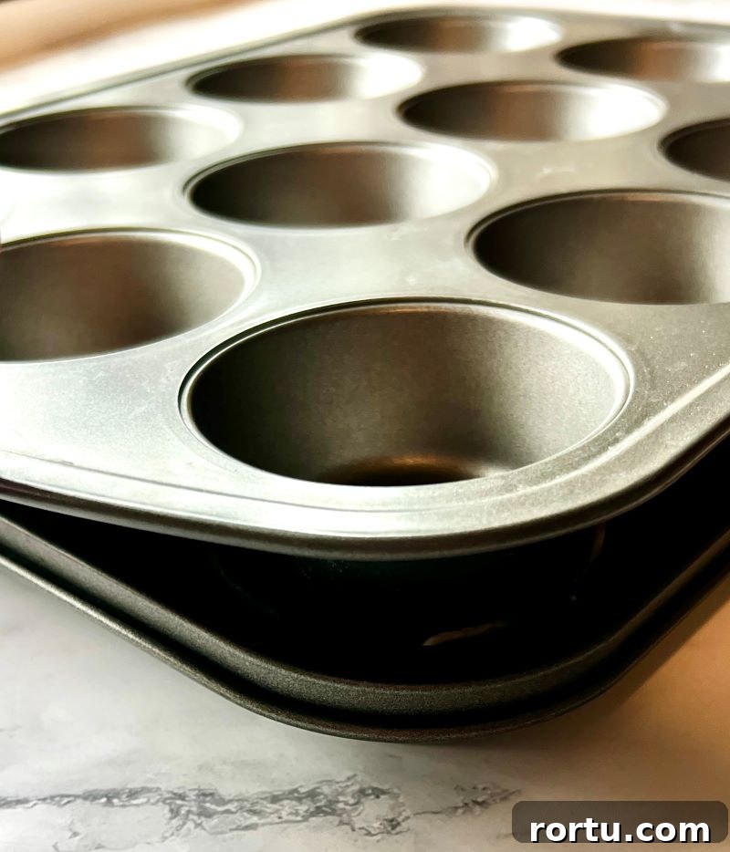 Top muffin pan sits snug in the muffin pan with pancetta