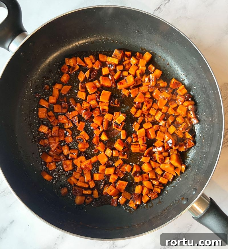 Cooked sweet potatoes with BBQ chipotle sauce.