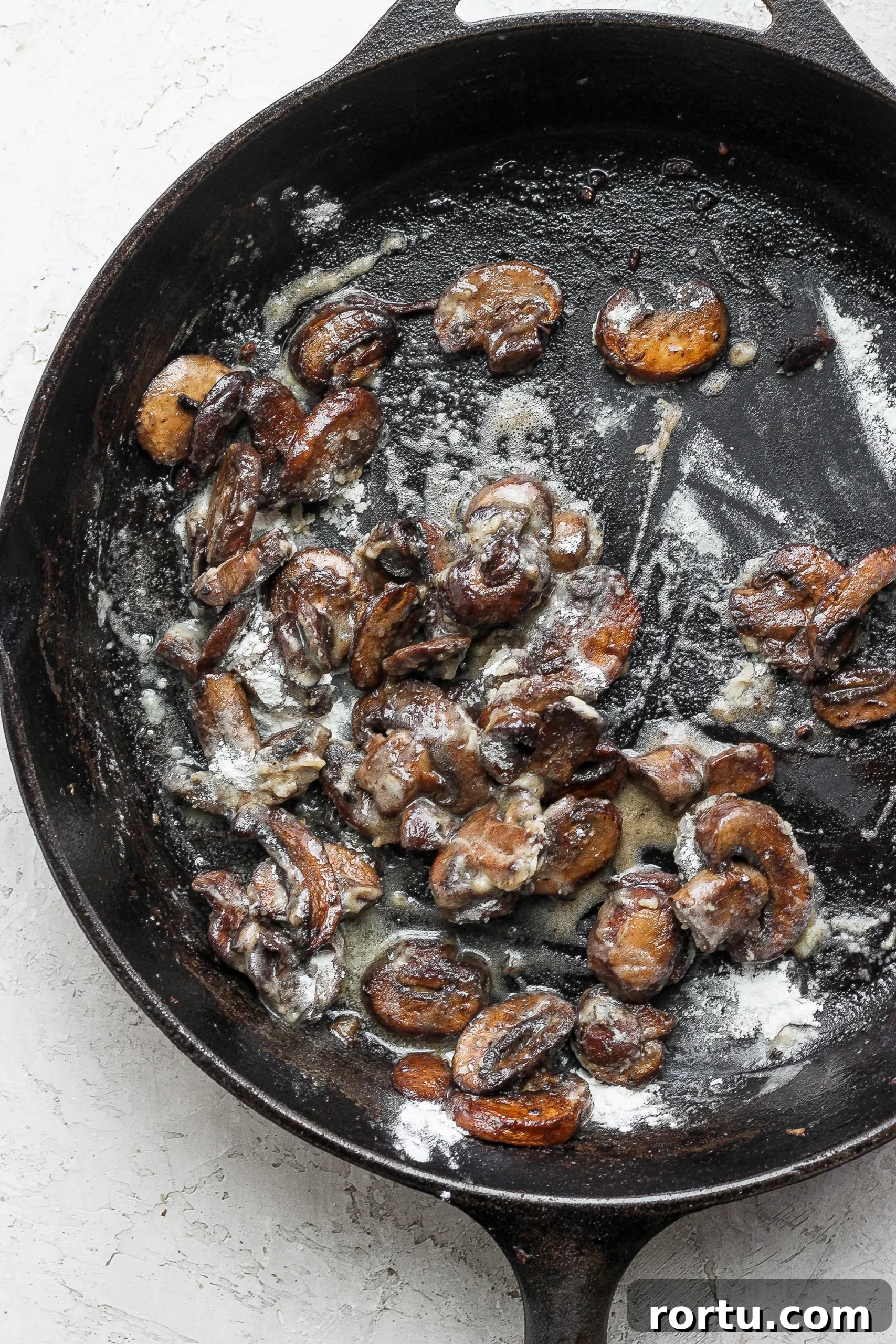 Sautéed mushrooms sauteed mushrooms in a cast iron skillet for ground beef stroganoff
