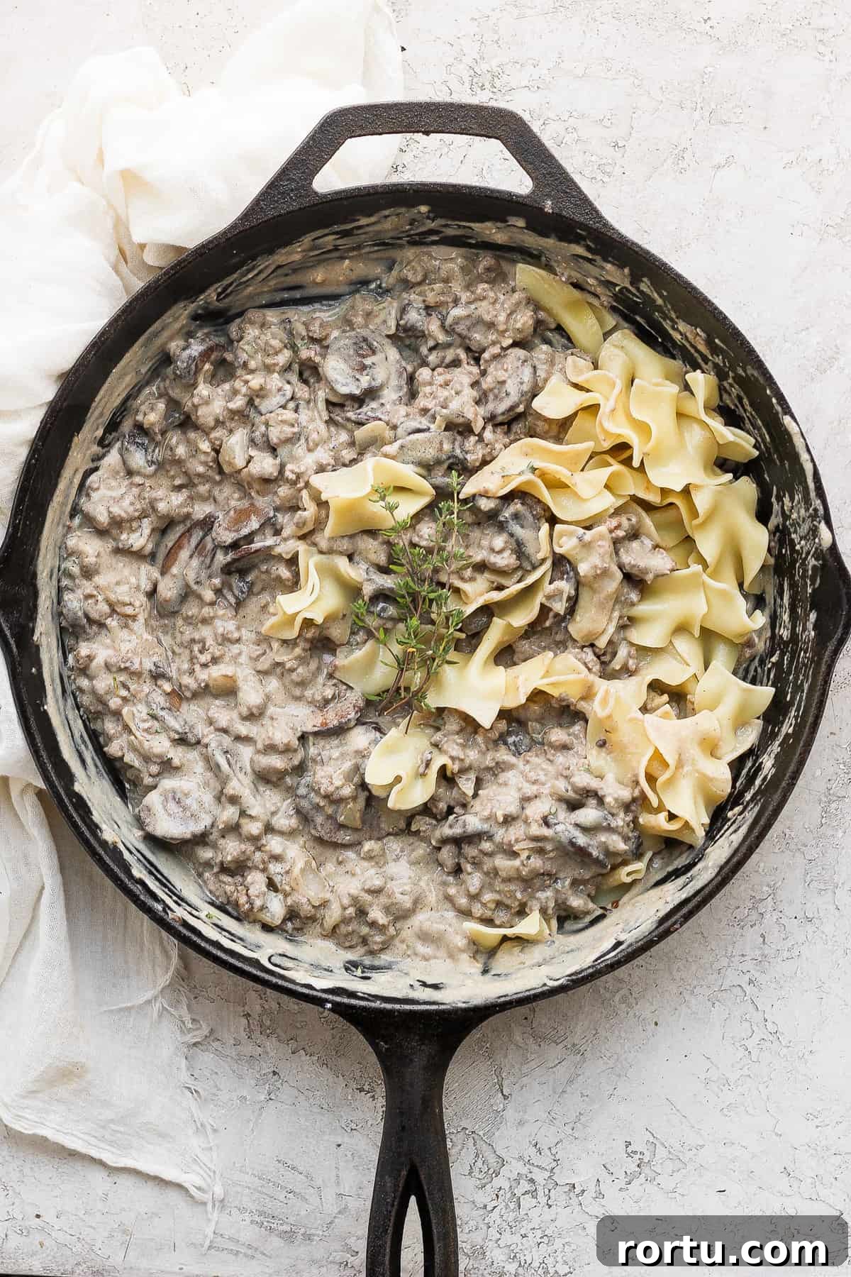 Stroganoff with egg noodles ground beef stroganoff in a cast iron skillet with egg noodles