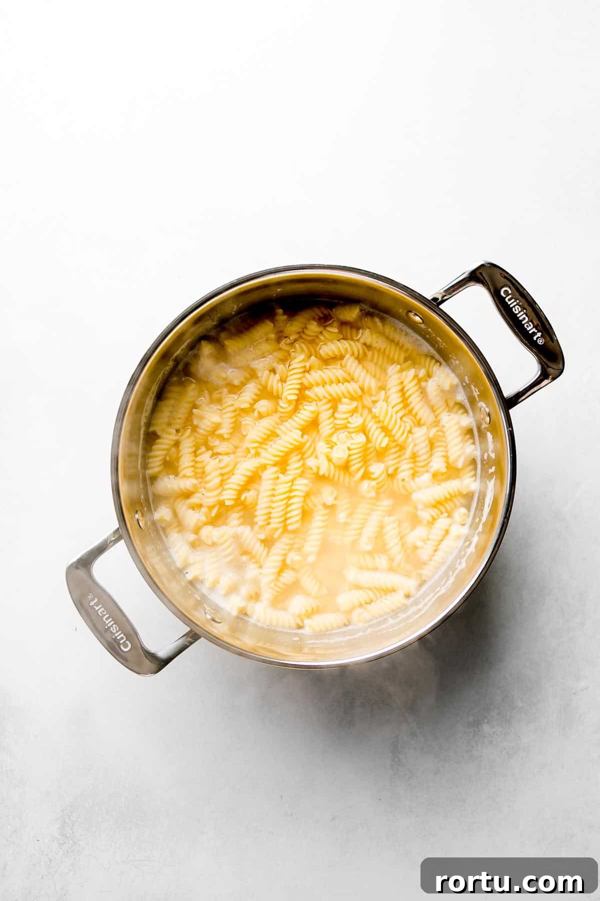 Gluten free pasta in pot of water.