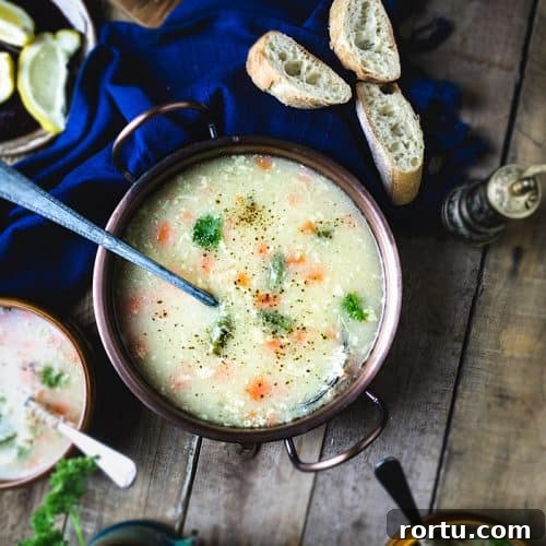 Overhead view of the main serving bowl with Bey's soup and crusty bread slices.