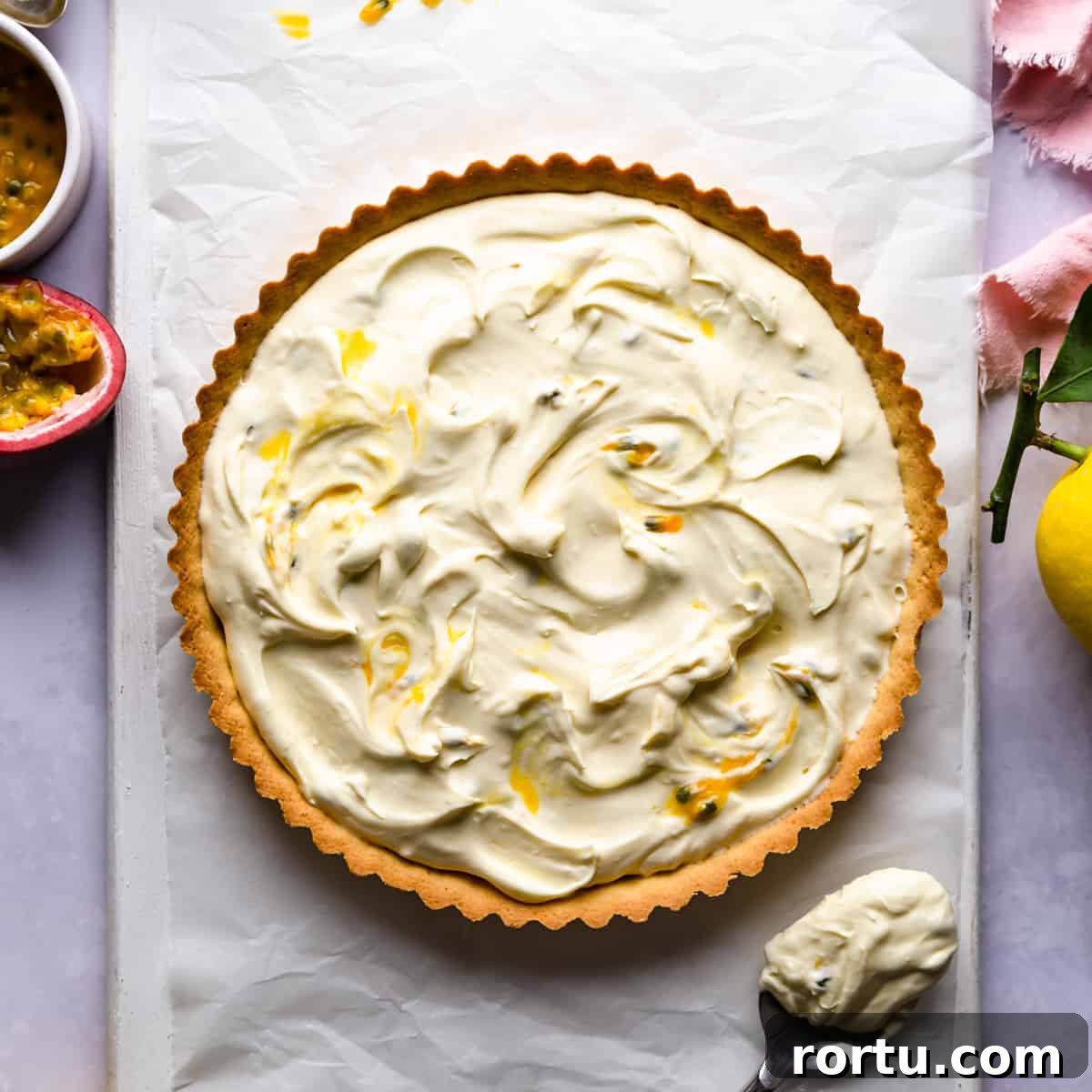 Lemon Mascarpone Tart Recipe — Creamy Citrus Dessert 5 sweet tart shell filled with mascarpone cheese mixed with some passion fruit.