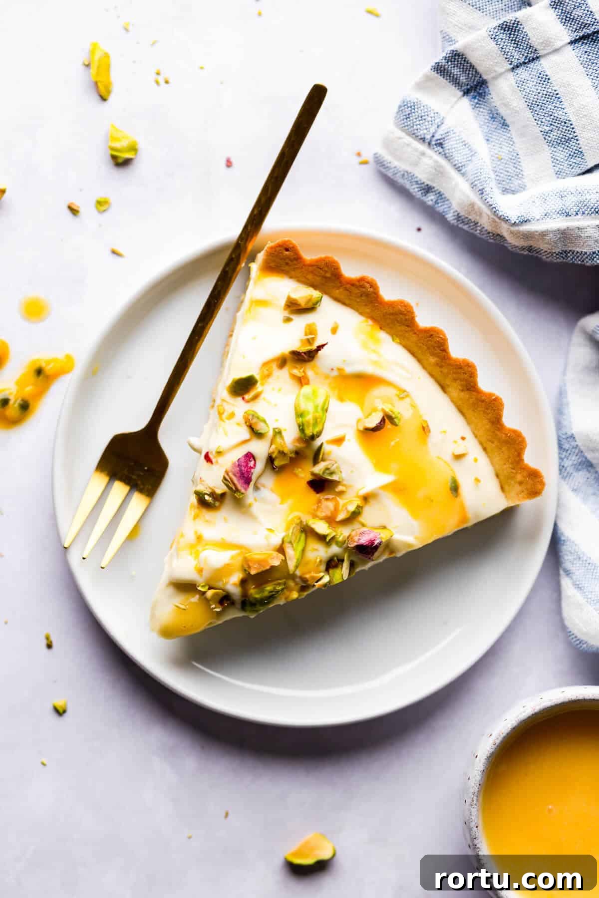 Lemon Mascarpone Tart Recipe — Creamy Citrus Dessert 9 top view photo of a slice of tart on a plate