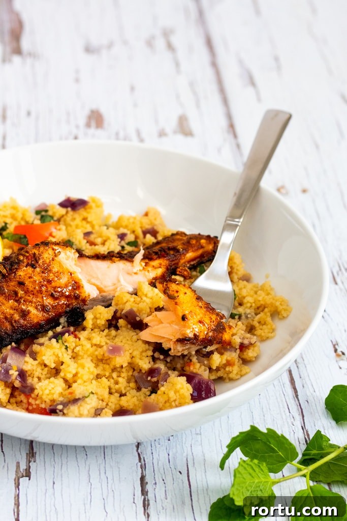 Moroccan-Spiced Salmon: Quick Midweek Dinner Recipe 3 Moroccan spiced salmon with ras el hanout on top of couscous