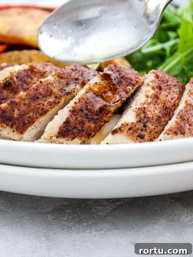 fall spice roasted chicken breast sliced in plate close up