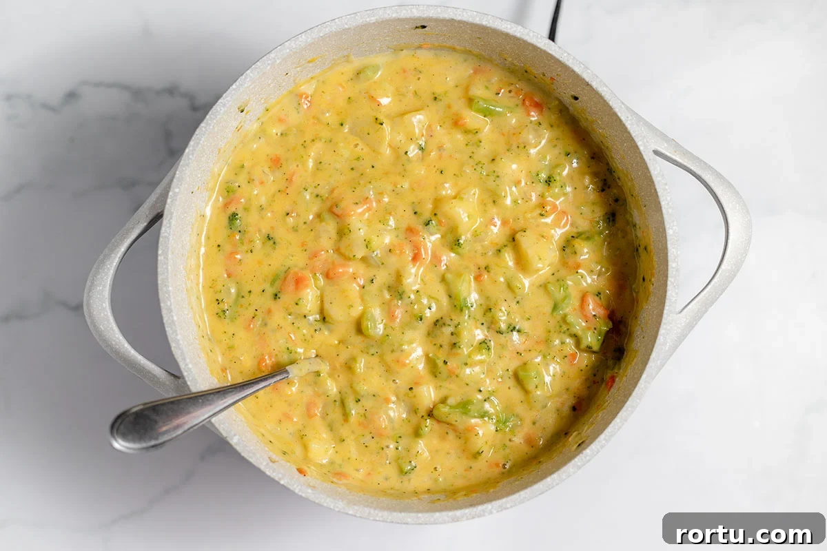 Creamy Broccoli, Potato & Cheddar Soup Recipe 9 Broccoli Potato Cheese Soup in stock pot.