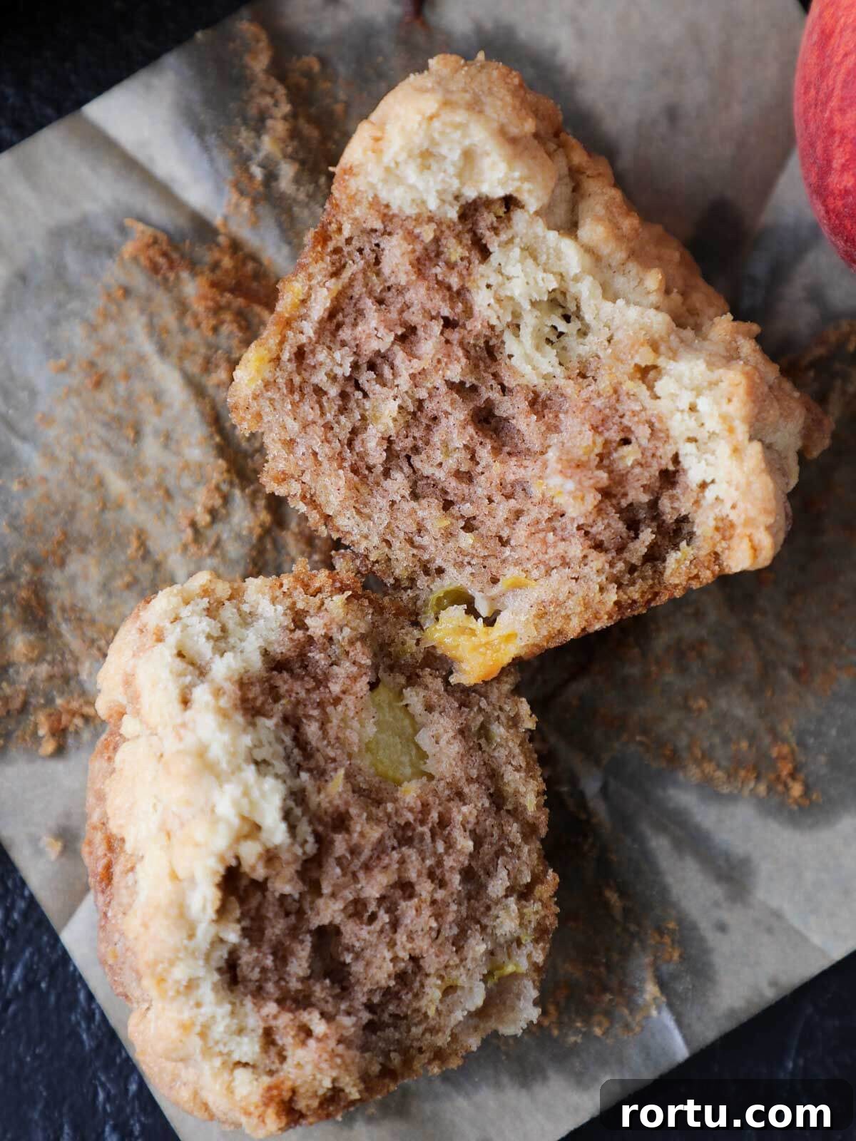 Perfect Streusel Topping Recipe for Crispy, Buttery Crumbles 4 Streusel topped peach muffins split open.