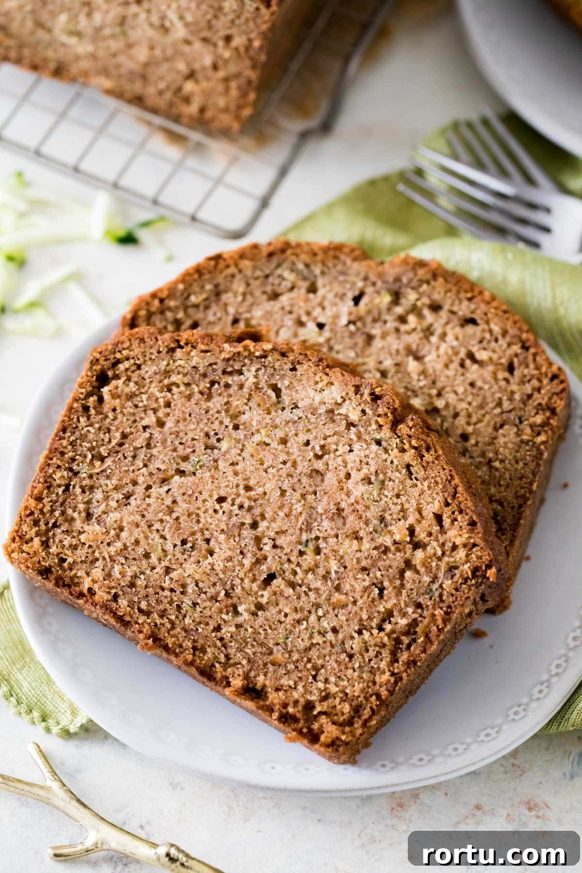 two slices of zucchini bread on white plate
