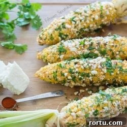 Mexican Corn Cobs on Board with Cilantro and Cheese