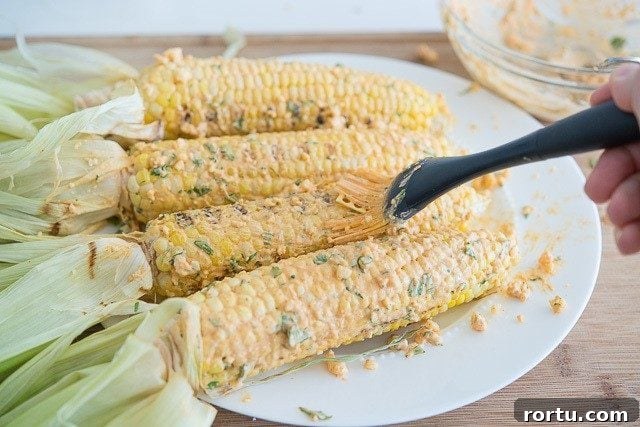 Brushing Corn Cobs with Spicy Butter