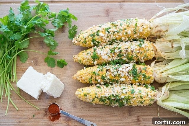 Cobs of Corn Coated in Cotija Cheese and Cilantro