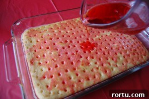 Strawberry Jello Poke Cake Recipe with Creamy Frosting 4 img 17077 4