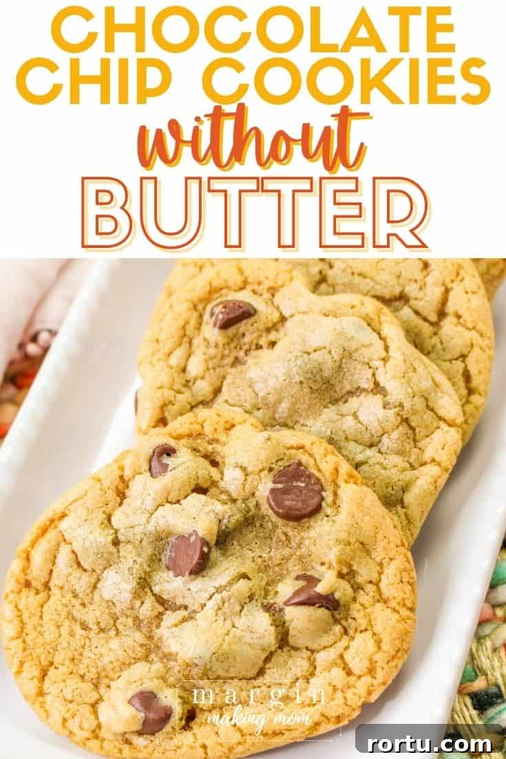 Chocolate Chip Cookies Without Butter — Made with Oil 2 a few no butter chocolate chip cookies on a white rectangular serving platter