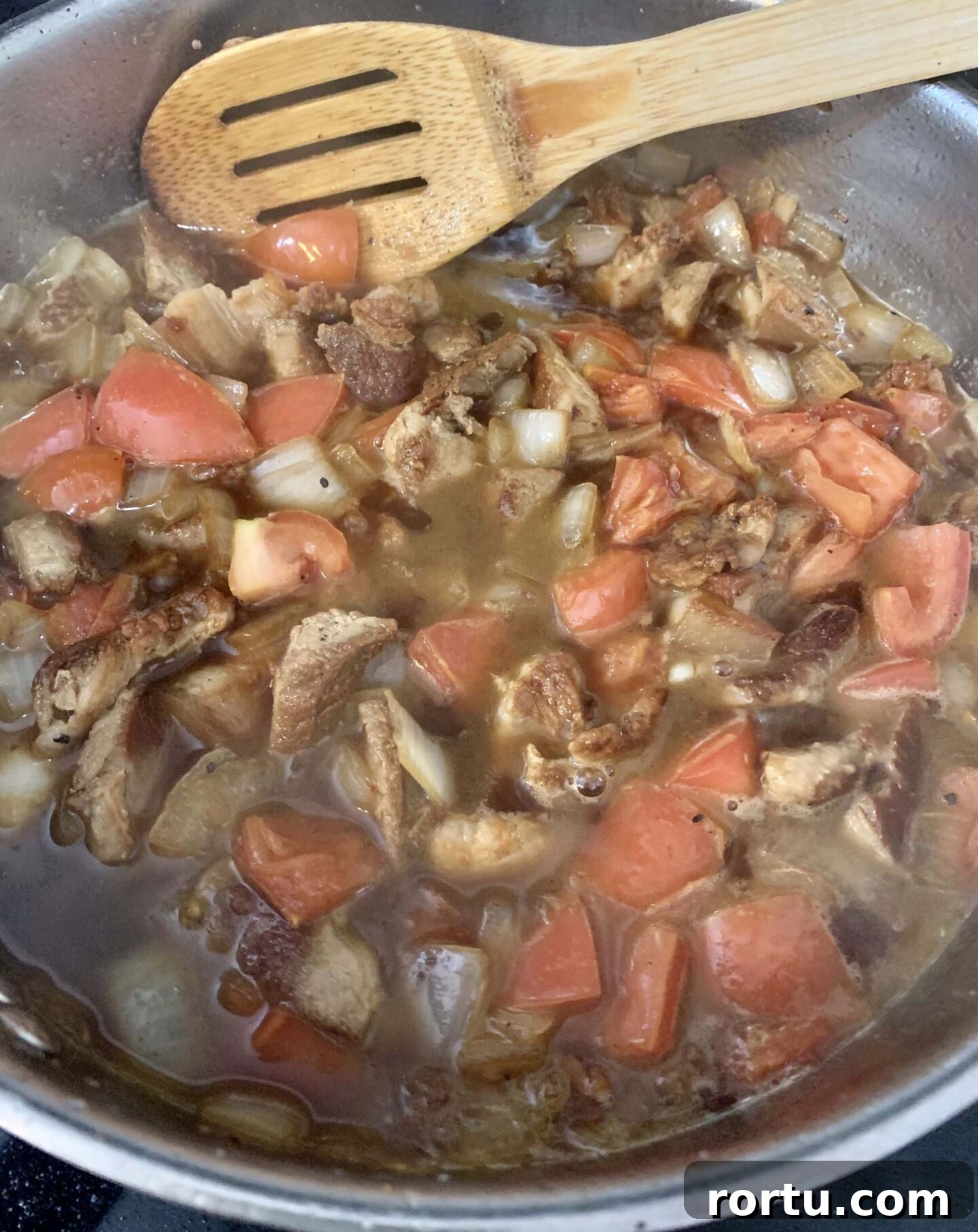 adding the diced tomatoes