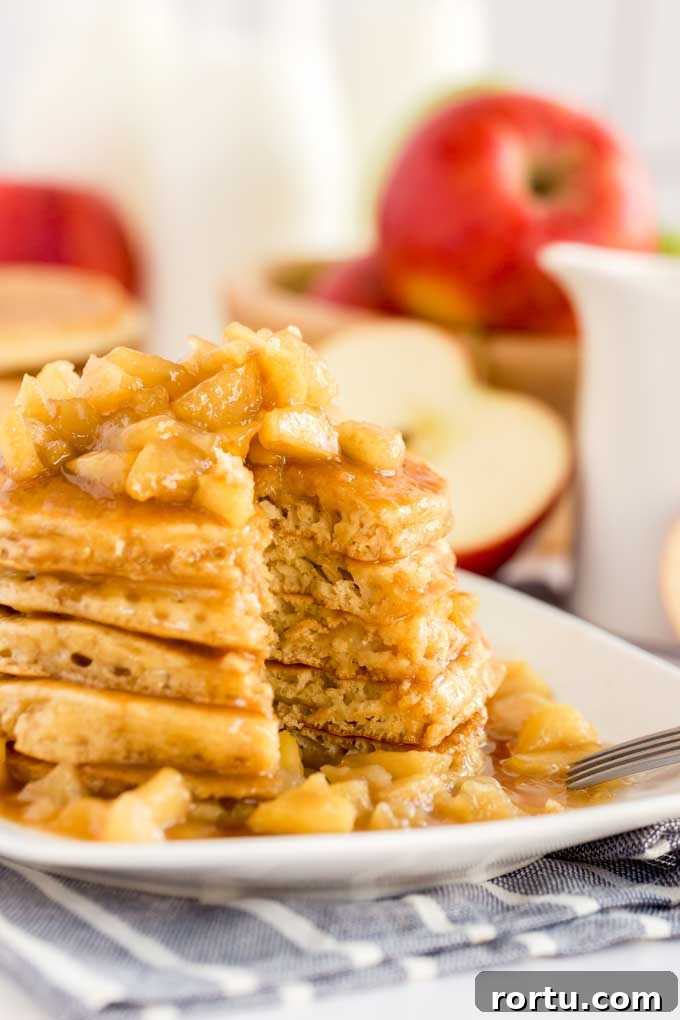 Pancakes with caramel apples on a white plate