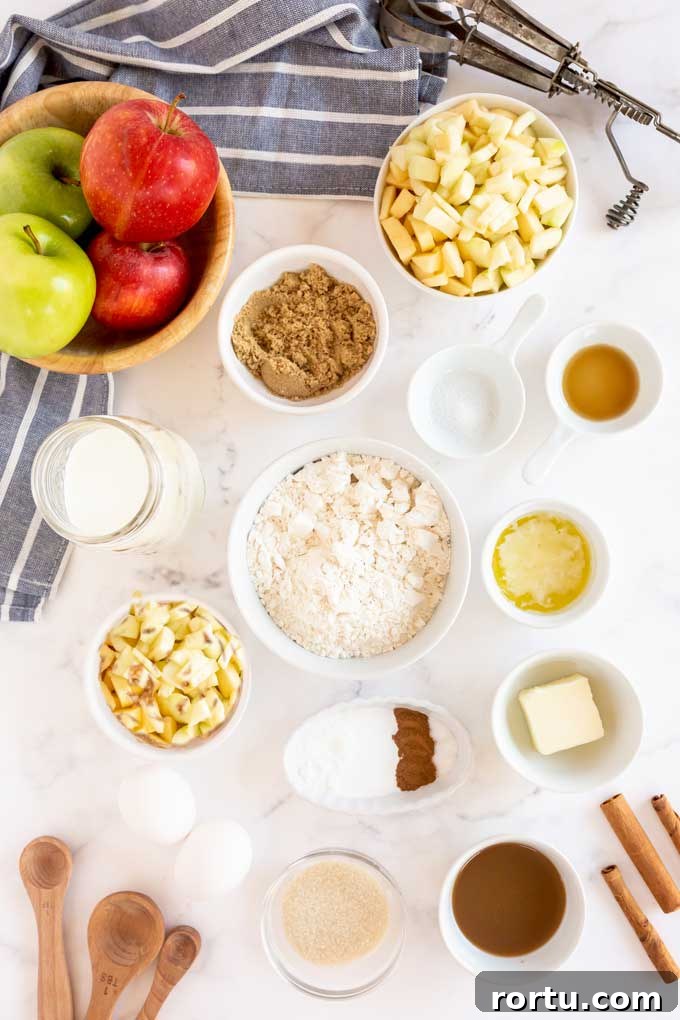 Apple pancakes ingredients on a white surface.