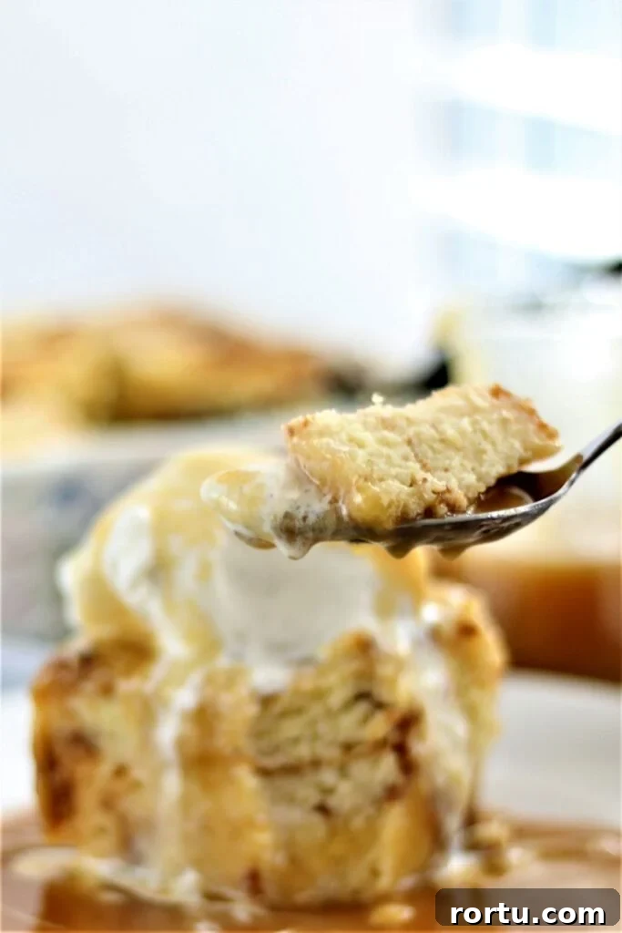 Gluten-Free ʻOhana Bread Pudding Recipe – Hawaiian Comfort Dessert 10 taking a bite of bread pudding on a spoon