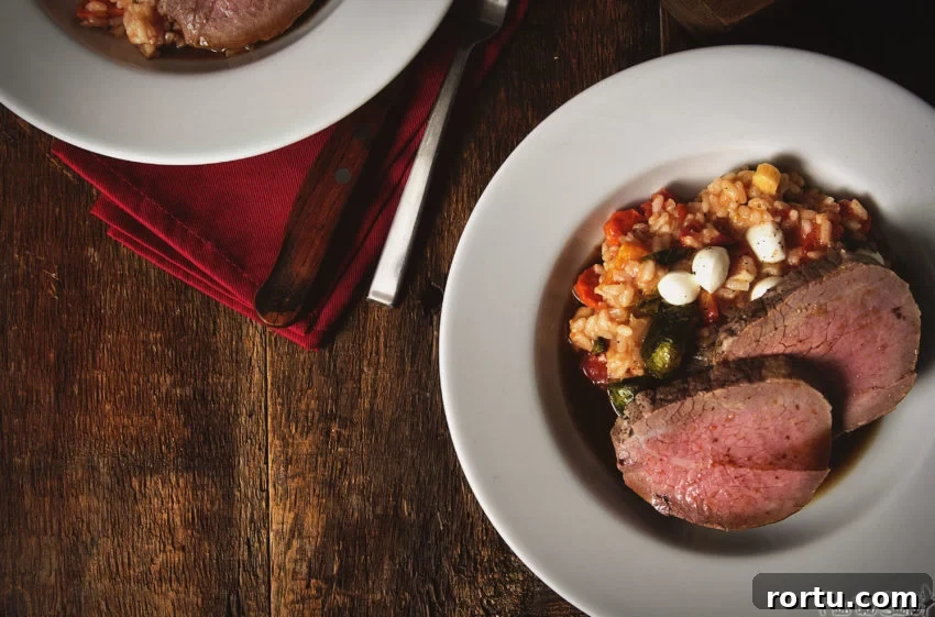 Tender Slow-Roasted Eye Round: Juicy, Melts in Your Mouth 2 Dish of fall risotto and two slices of perfectly cooked eye of round roast