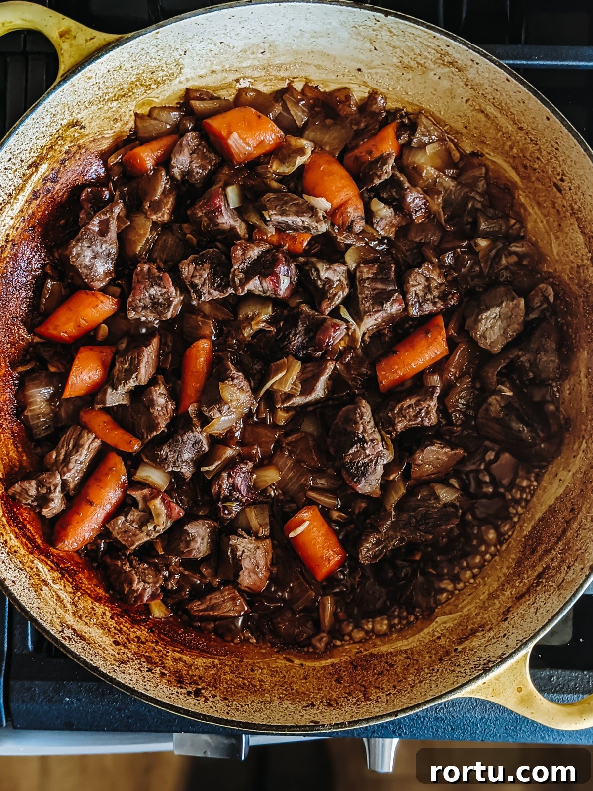 Tender Slow-Roasted Eye Round: Juicy, Melts in Your Mouth 7 Stew meat and veggies in the pot ready to make the au jus.