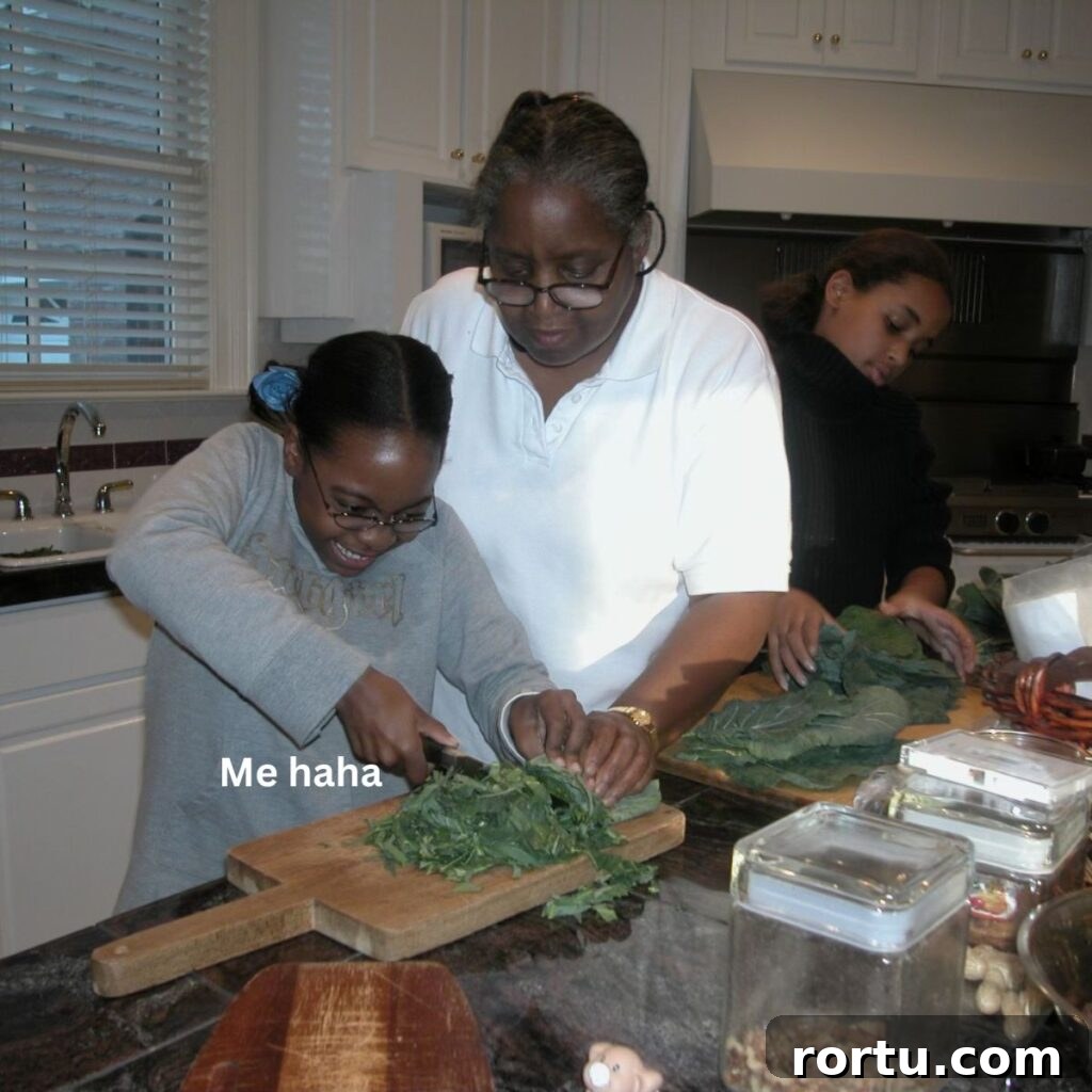 Authentic Southern Collard Greens Recipe for Soul Food Fans 3 Photo of a younger August, cutting collard greens.