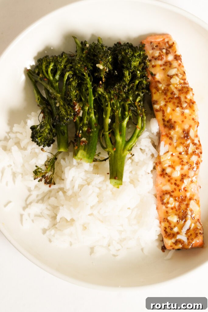 Maple Mustard Baked Salmon Recipe for Tender Glazed Fillets 12 plate of salmon, rice, and broccoli