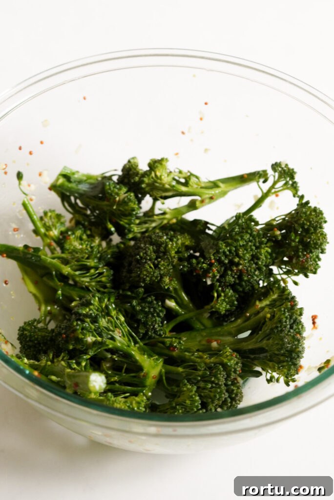 Maple Mustard Baked Salmon Recipe for Tender Glazed Fillets 8 seasoned raw broccoli in a mixing bowl