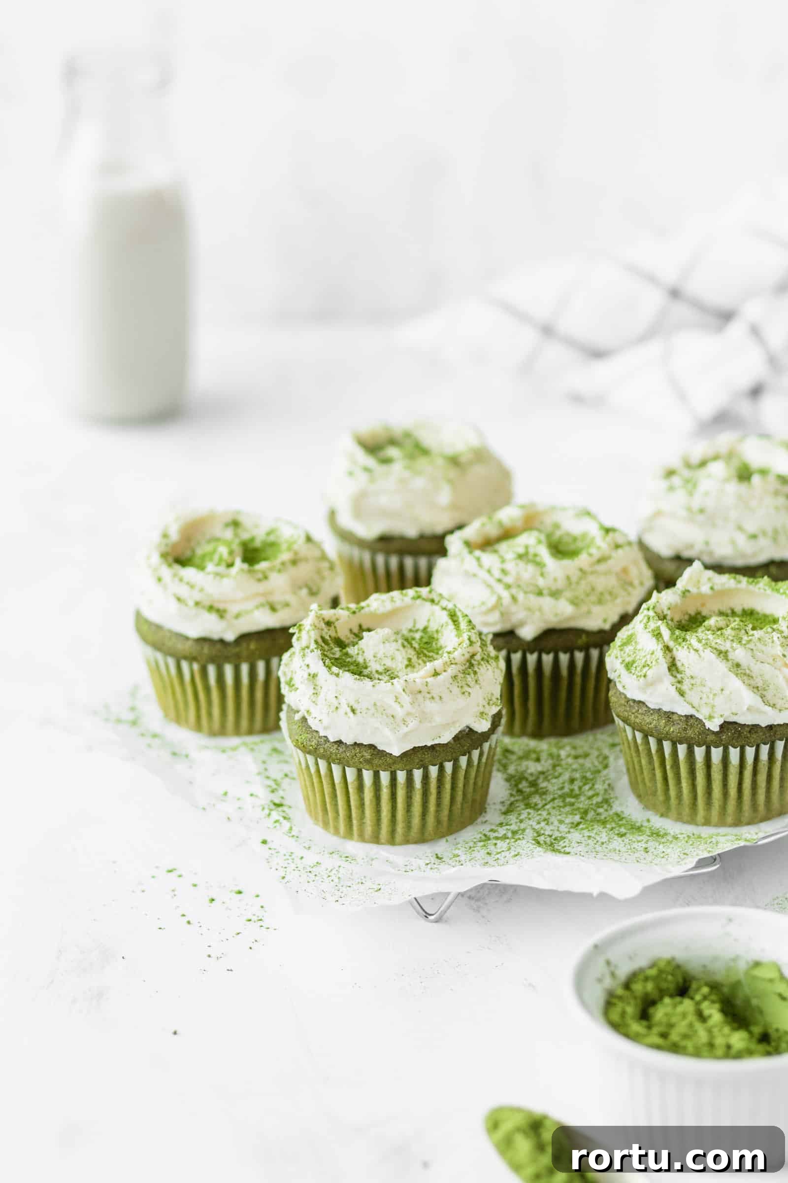 Fluffy Matcha Cupcakes: How to Make Moist Green Tea Cupcakes (Video) 3 Matcha cupcakes with white chocolate cream cheese frosting