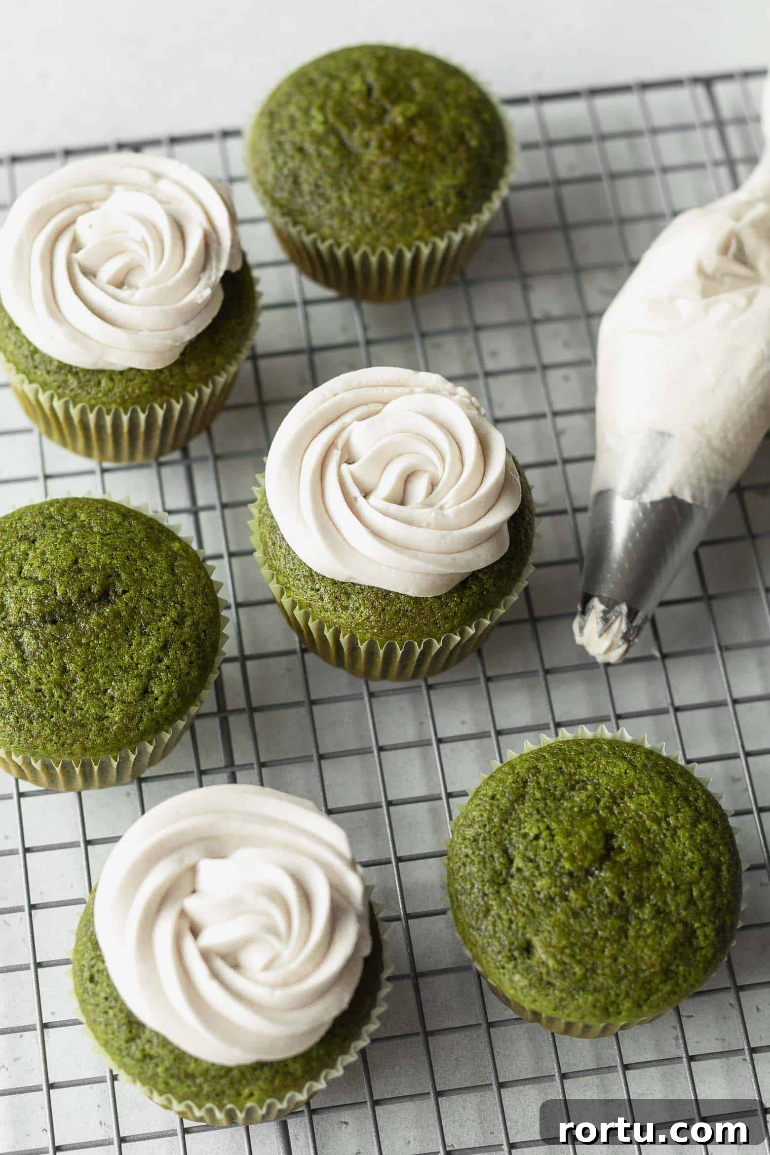 Fluffy Matcha Cupcakes: How to Make Moist Green Tea Cupcakes (Video) 8 White chocolate frosting piped on matcha green tea cupcakes