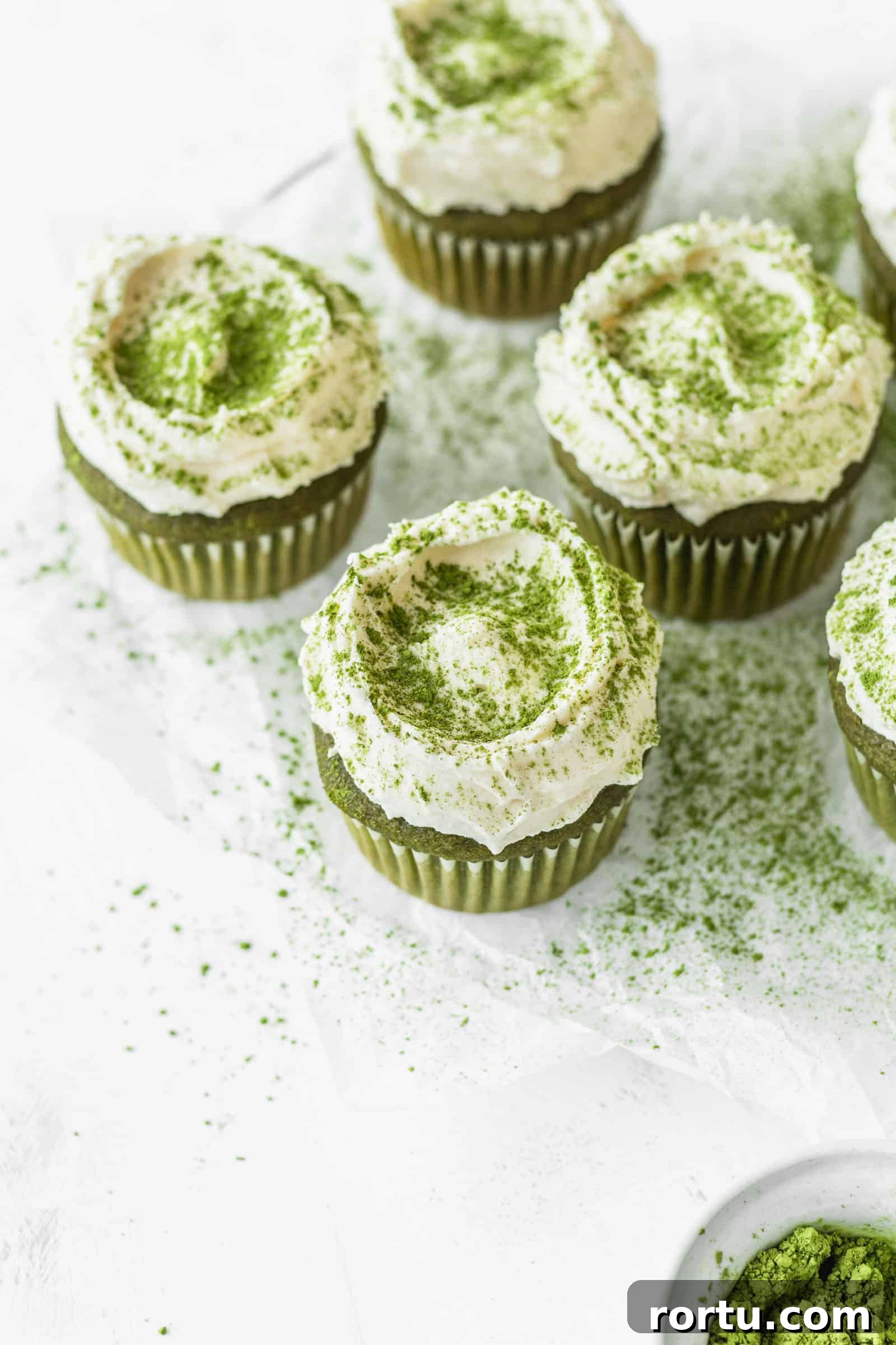 Fluffy Matcha Cupcakes: How to Make Moist Green Tea Cupcakes (Video) 10 Fluffy white chocolate frosting on matcha green tea cupcakes